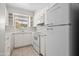 Well-lit kitchen with classic white appliances and ample cabinet space for storage at 3036 N 32Nd St # 314, Phoenix, AZ 85018