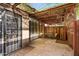 Cozy covered patio with brick accents, wrought iron door, and garden trellis overhead at 3036 N 32Nd St # 314, Phoenix, AZ 85018