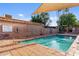 Spanish Gardens North community pool surrounded by well-kept brick walls and landscaping at 3036 N 32Nd St # 314, Phoenix, AZ 85018