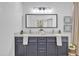 Charming bathroom featuring a double sink vanity with marble countertop, gray cabinets, and modern faucets at 3050 S Cascade Pl, Chandler, AZ 85248