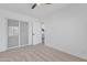 Cozy bedroom with plush carpeting, ceiling fan, and closet; a serene retreat for rest and relaxation at 3050 S Cascade Pl, Chandler, AZ 85248