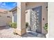 Elegant front door with decorative metalwork, complementing the home's exterior at 3050 S Cascade Pl, Chandler, AZ 85248