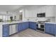 Modern kitchen featuring two-tone cabinets, stainless steel appliances, and quartz countertops at 3050 S Cascade Pl, Chandler, AZ 85248