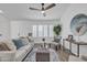 Inviting living room with modern decor, stylish seating, and a ceiling fan for comfort at 3050 S Cascade Pl, Chandler, AZ 85248