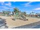 Community playground area with modern play structures, soft sand flooring, and nearby seating for parents to supervise children at 3050 S Cascade Pl, Chandler, AZ 85248