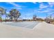 Well-maintained community tennis court surrounded by lush landscaping, offering a perfect spot for friendly matches and outdoor recreation at 3050 S Cascade Pl, Chandler, AZ 85248