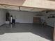 Spacious epoxy floor garage with storage shelves and ample space at 31487 N Blackfoot Dr, San Tan Valley, AZ 85143