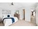 Bright bedroom with a queen bed, dresser, and carpet at 320 E Mckellips Rd # 227, Mesa, AZ 85201