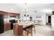 View from the kitchen island to a well lit open plan layout that flows into the living area at 320 E Mckellips Rd # 227, Mesa, AZ 85201