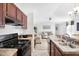 Modern kitchen with a gas range and stainless steel sink at 320 E Mckellips Rd # 227, Mesa, AZ 85201