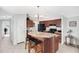 Stylish kitchen island with bar seating and ample counter space, paired with modern appliances at 320 E Mckellips Rd # 227, Mesa, AZ 85201