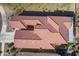 Aerial shot of the home and patio, showing tile roof and desert landscaping at 336 N Monterey Ct, Casa Grande, AZ 85194