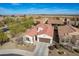 Aerial view of the charming home with desert landscaping, complemented by community views at 336 N Monterey Ct, Casa Grande, AZ 85194