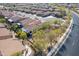 Aerial view of the home, showing landscaping, patio and tile roof in neighborhood at 336 N Monterey Ct, Casa Grande, AZ 85194