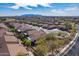 Aerial shot of the community, with mountain views and desert landscaping at 336 N Monterey Ct, Casa Grande, AZ 85194