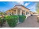 Covered back patio with pergola and desert landscaping for outdoor enjoyment and privacy at 336 N Monterey Ct, Casa Grande, AZ 85194