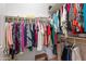 Organized walk-in closet featuring clothing racks, shelving, and a small stool, maximizing storage efficiency at 336 N Monterey Ct, Casa Grande, AZ 85194