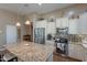 Well-equipped kitchen featuring modern appliances, granite countertops, and ample storage at 336 N Monterey Ct, Casa Grande, AZ 85194