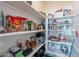 Walk-in pantry with organized shelving, providing ample storage for groceries and kitchen essentials at 336 N Monterey Ct, Casa Grande, AZ 85194