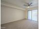 Bedroom with ceiling fan and sliding glass doors to the outside at 3420 W Danbury Dr # C216, Phoenix, AZ 85053