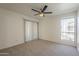 Bedroom with ceiling fan, and window with view at 3420 W Danbury Dr # C216, Phoenix, AZ 85053