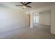 Bedroom with ceiling fan and mirrored closet door at 3420 W Danbury Dr # C216, Phoenix, AZ 85053