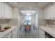 View of the bright dining room with table and chairs from kitchen at 3420 W Danbury Dr # C216, Phoenix, AZ 85053