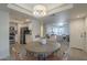 Open dining area featuring modern furnishings, flowing into a kitchen with stainless steel appliances at 3420 W Danbury Dr # C216, Phoenix, AZ 85053