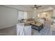 Bright living room featuring a ceiling fan, recessed lighting, and neutral colors creating a warm and inviting atmosphere at 3420 W Danbury Dr # C216, Phoenix, AZ 85053