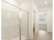 Bright bathroom featuring a glass-enclosed shower, tile flooring, and neutral color palette at 3508 E Audrey Dr, San Tan Valley, AZ 85143