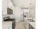 Modern kitchen featuring stainless steel appliances, quartz countertops, and stylish pendant lighting fixtures at 3508 E Audrey Dr, San Tan Valley, AZ 85143