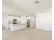 Modern kitchen boasts white cabinets, stainless steel appliances, and center island perfect for entertaining at 3508 E Audrey Dr, San Tan Valley, AZ 85143