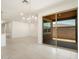 Open concept living space with kitchen and a sliding glass door to the exterior patio at 3508 E Audrey Dr, San Tan Valley, AZ 85143