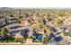 Aerial view captures a lush neighborhood with a private backyard pool and manicured landscaping at 3531 E Becker Ln, Phoenix, AZ 85028