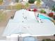 Aerial view of the home showcasing the backyard pool and well-maintained roof at 3531 E Becker Ln, Phoenix, AZ 85028