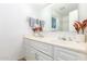 Bright bathroom features a double vanity with white cabinets and drawers, a large mirror, and tasteful decor at 3531 E Becker Ln, Phoenix, AZ 85028