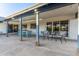 Spacious covered patio with brick columns, modern furniture and outdoor dining area at 3531 E Becker Ln, Phoenix, AZ 85028