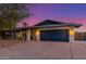 Charming home featuring a spacious driveway and a deep blue garage door at 3531 E Becker Ln, Phoenix, AZ 85028