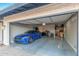 Garage with a blue car and lots of storage space at 3531 E Becker Ln, Phoenix, AZ 85028