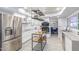 Modern kitchen with stainless steel appliances, white cabinets, and a stylish kitchen island at 3531 E Becker Ln, Phoenix, AZ 85028