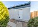 Backyard outbuilding featuring a secure entrance and clean white exterior at 3531 E Becker Ln, Phoenix, AZ 85028