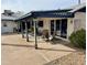 Relaxing covered patio with lounge seating, dining area and outdoor access at 3531 E Becker Ln, Phoenix, AZ 85028