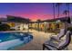 Backyard pool with outdoor seating areas, ideal for relaxation and gatherings at 3531 E Becker Ln, Phoenix, AZ 85028