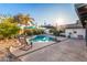 Private backyard pool area with lush landscaping and inviting lounge chairs at 3531 E Becker Ln, Phoenix, AZ 85028