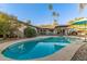 Inviting backyard pool featuring an outdoor seating area, perfect for entertaining and relaxation at 3531 E Becker Ln, Phoenix, AZ 85028