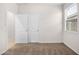 Bedroom featuring two closets, neutral paint, a window, and carpet at 36529 W San Capistrano Ave, Maricopa, AZ 85138