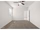 Bedroom featuring a ceiling fan, neutral paint, a window, and carpet at 36529 W San Capistrano Ave, Maricopa, AZ 85138