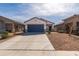 Charming single-story home with a two car garage and low-maintenance landscaping at 36529 W San Capistrano Ave, Maricopa, AZ 85138