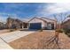 Inviting single-story home with tidy desert landscaping and a two-car garage at 36529 W San Capistrano Ave, Maricopa, AZ 85138