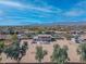 Aerial view of property featuring a pool, and ample entertaining space, RV parking and mountain views at 3707 N 188Th Ave, Litchfield Park, AZ 85340